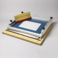 screen printing table with matching squeegee of the ceramictoner brand from mz Toner enables the application of coatings to the ceramic decal.